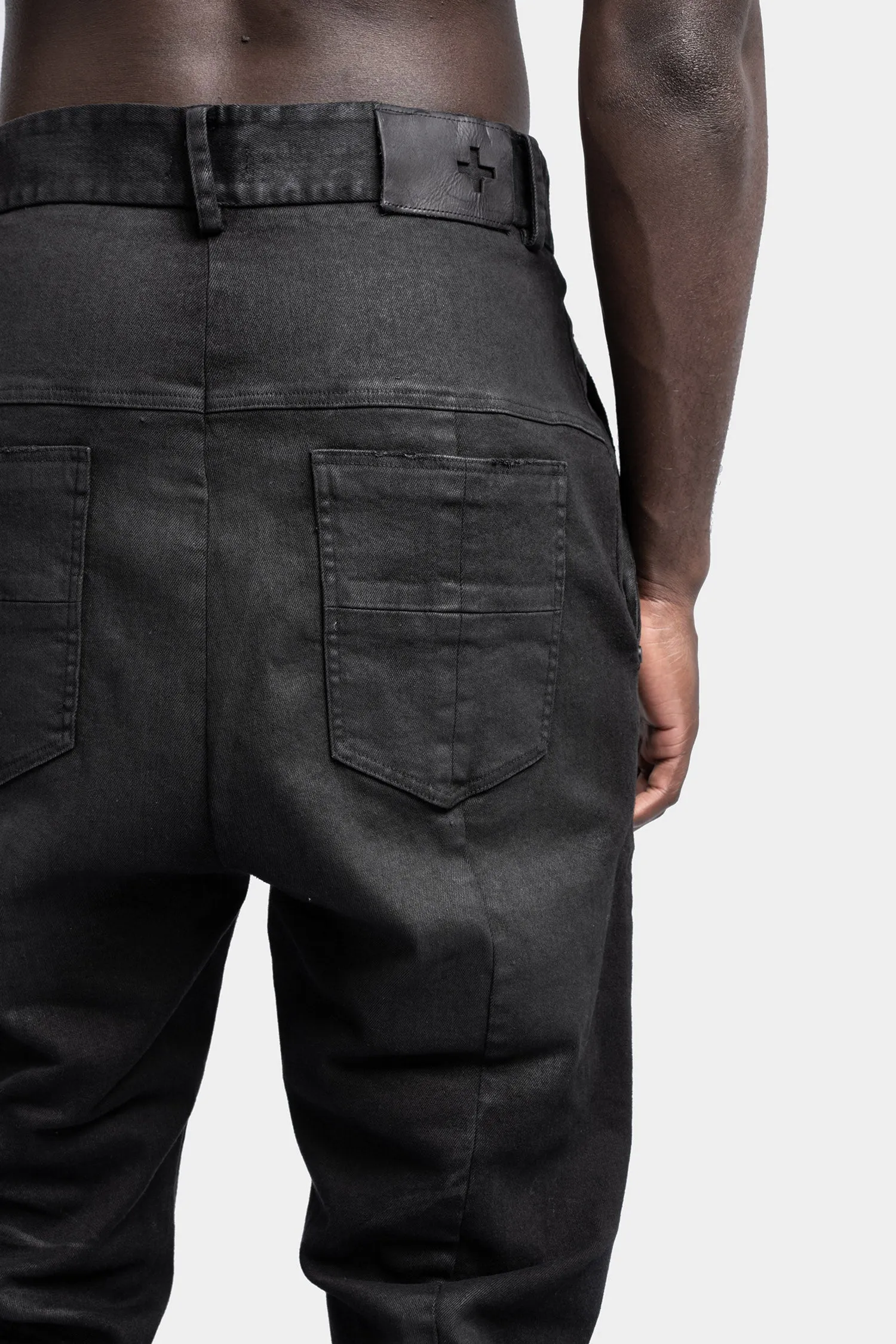 Waxed anatomical jeans